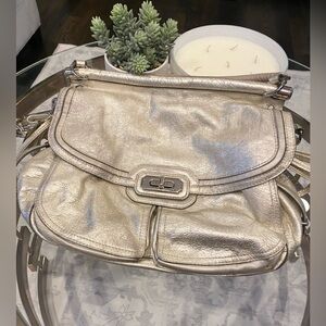 Coach gold tone handbag with clasp closure Has some wear removable twotone strap